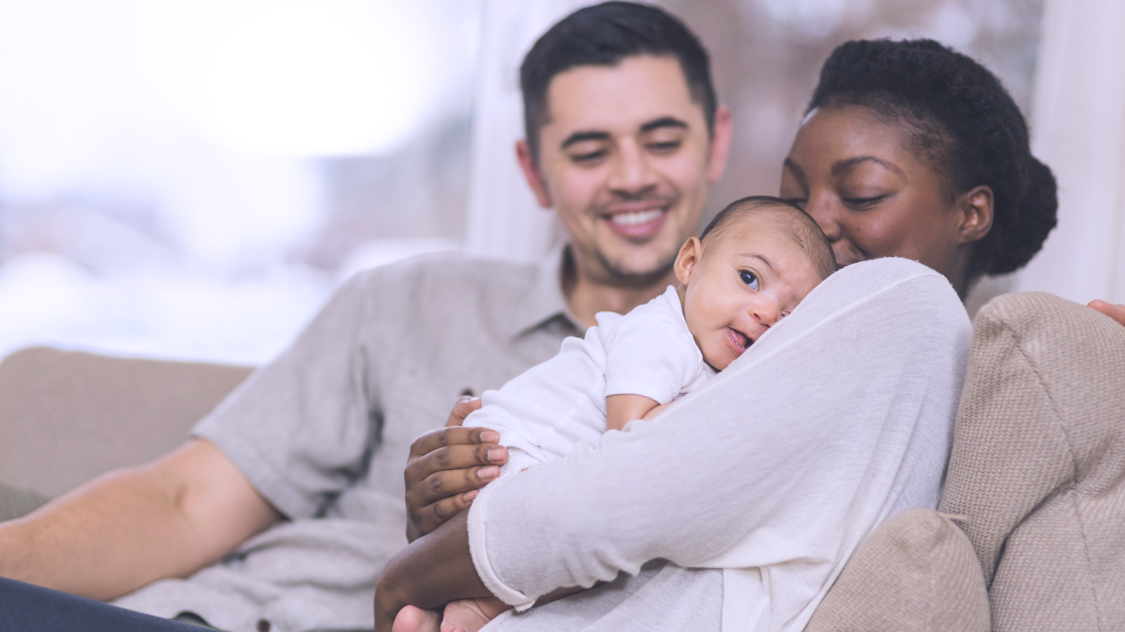 Mother and father holding their baby