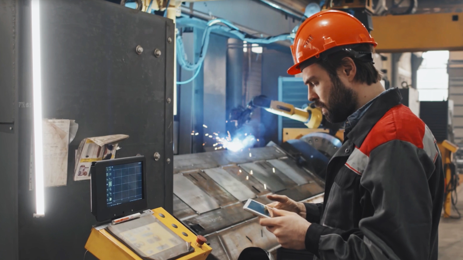 Man working in an automotive assembly factory