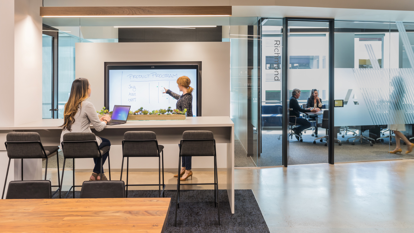 Image of Anaplan employees working and collaborating in one of our modern offices