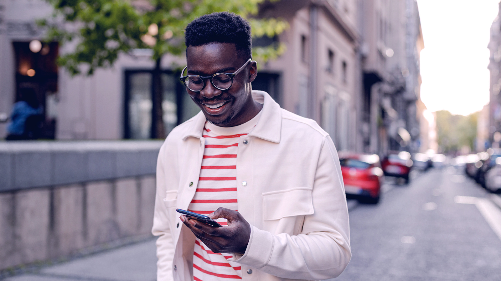 Men looking on the phone while walking