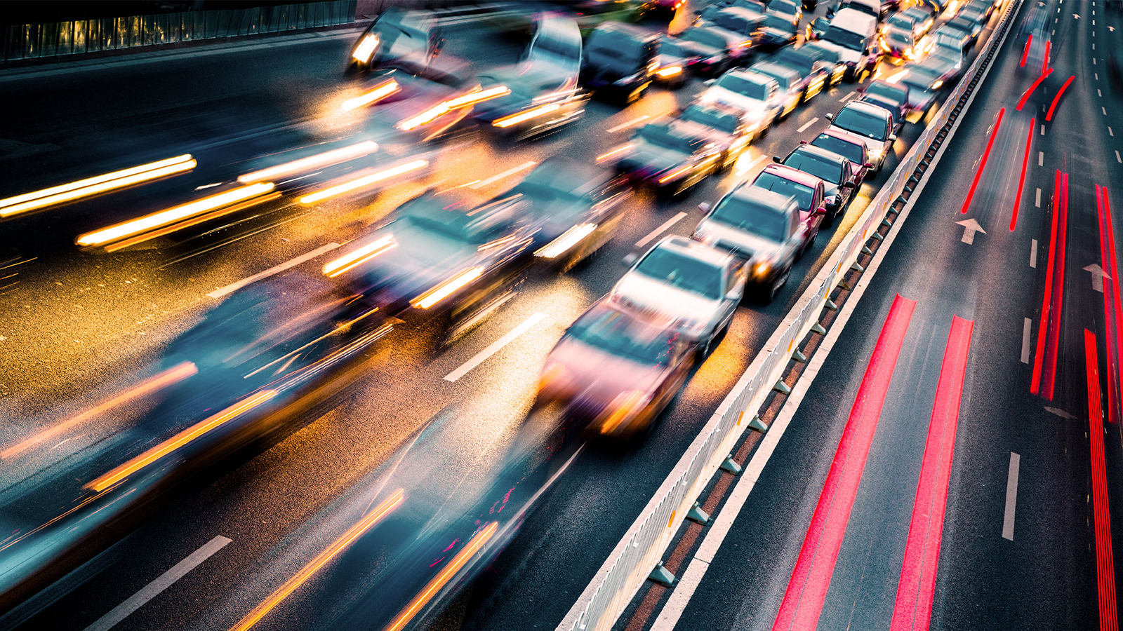 Anaplan white paper on financial success challenges. The text highlights how Decision Excellence solves DOTs funding challenges, with an image of a busy highway with streaking headlights and taillights.