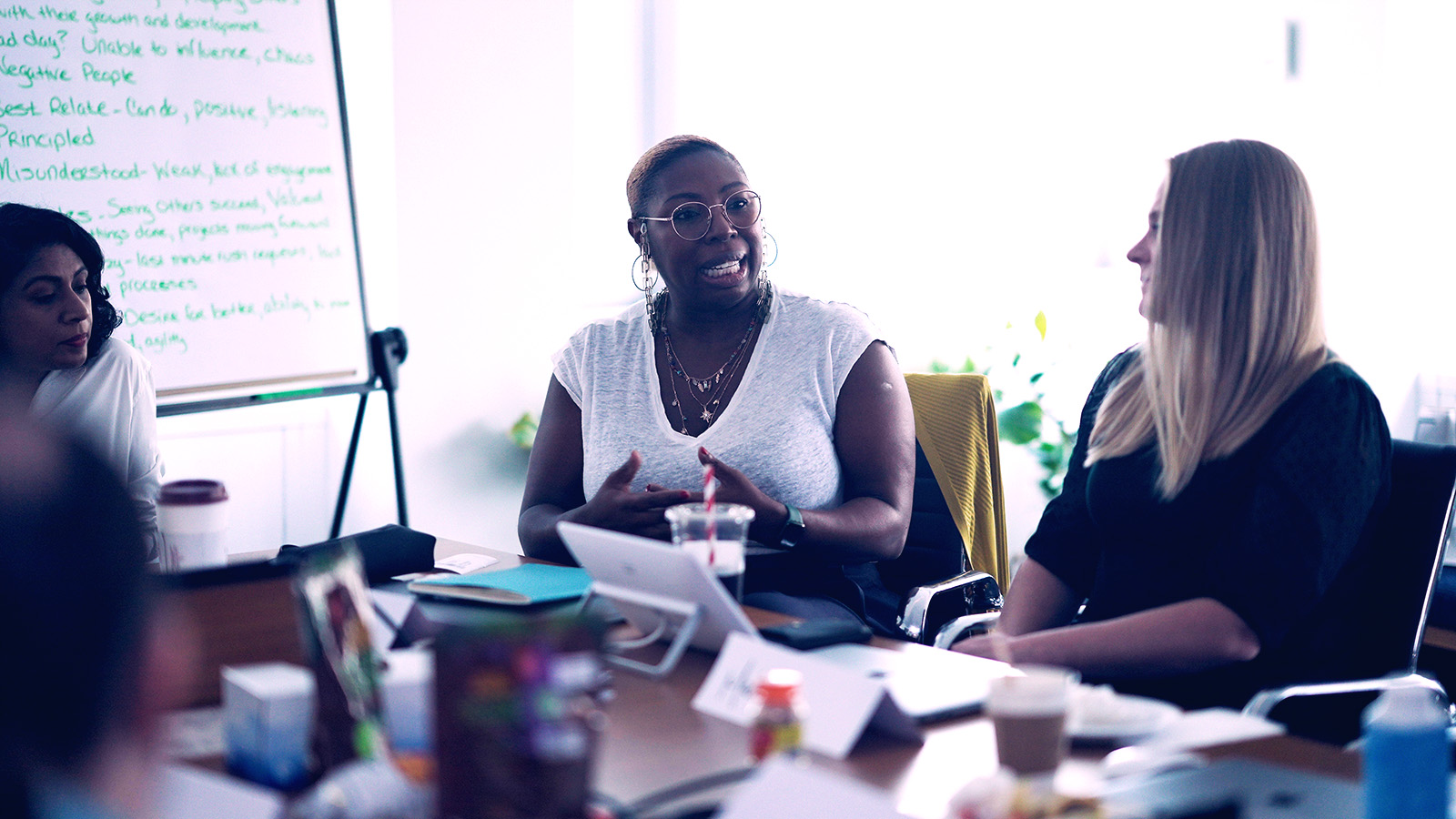 Three women at a table meeting