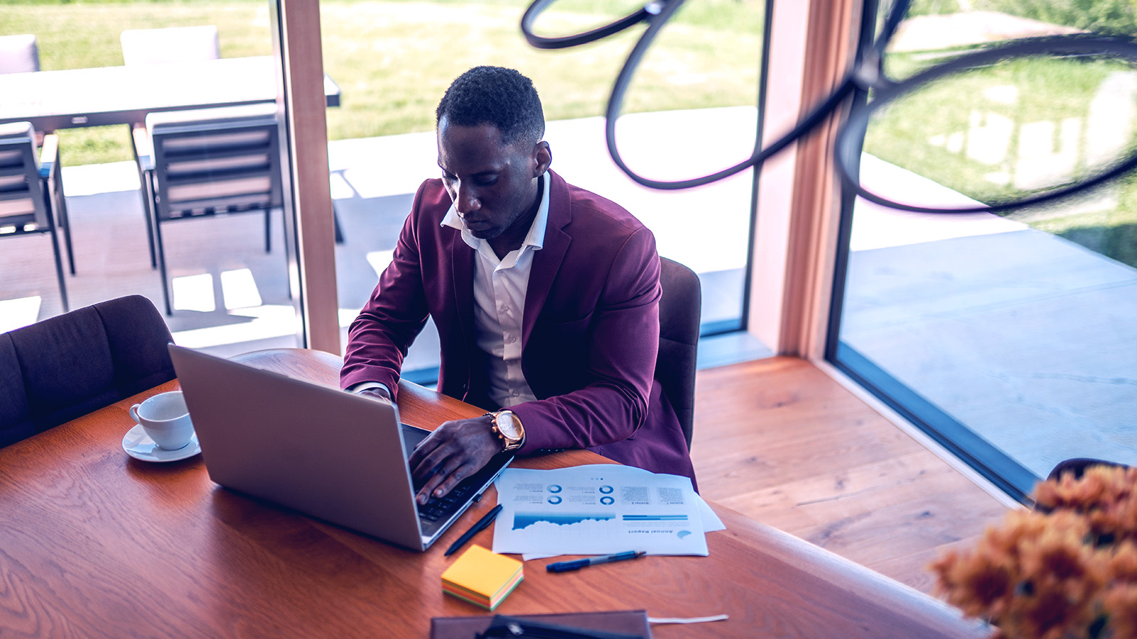 A men working on a laptop. 