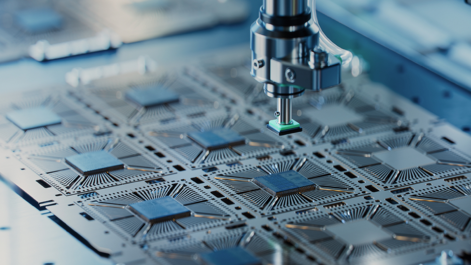 A close-up view of a machine actively processing a microchip, showcasing intricate components and precision engineering.