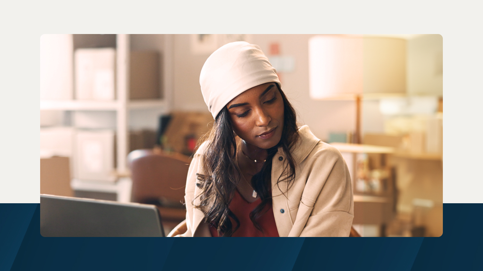 Anaplan solution brief on demand planning. The text highlights tackling demand planning challenges head-on, with an image of a woman working on a laptop in a business setting.