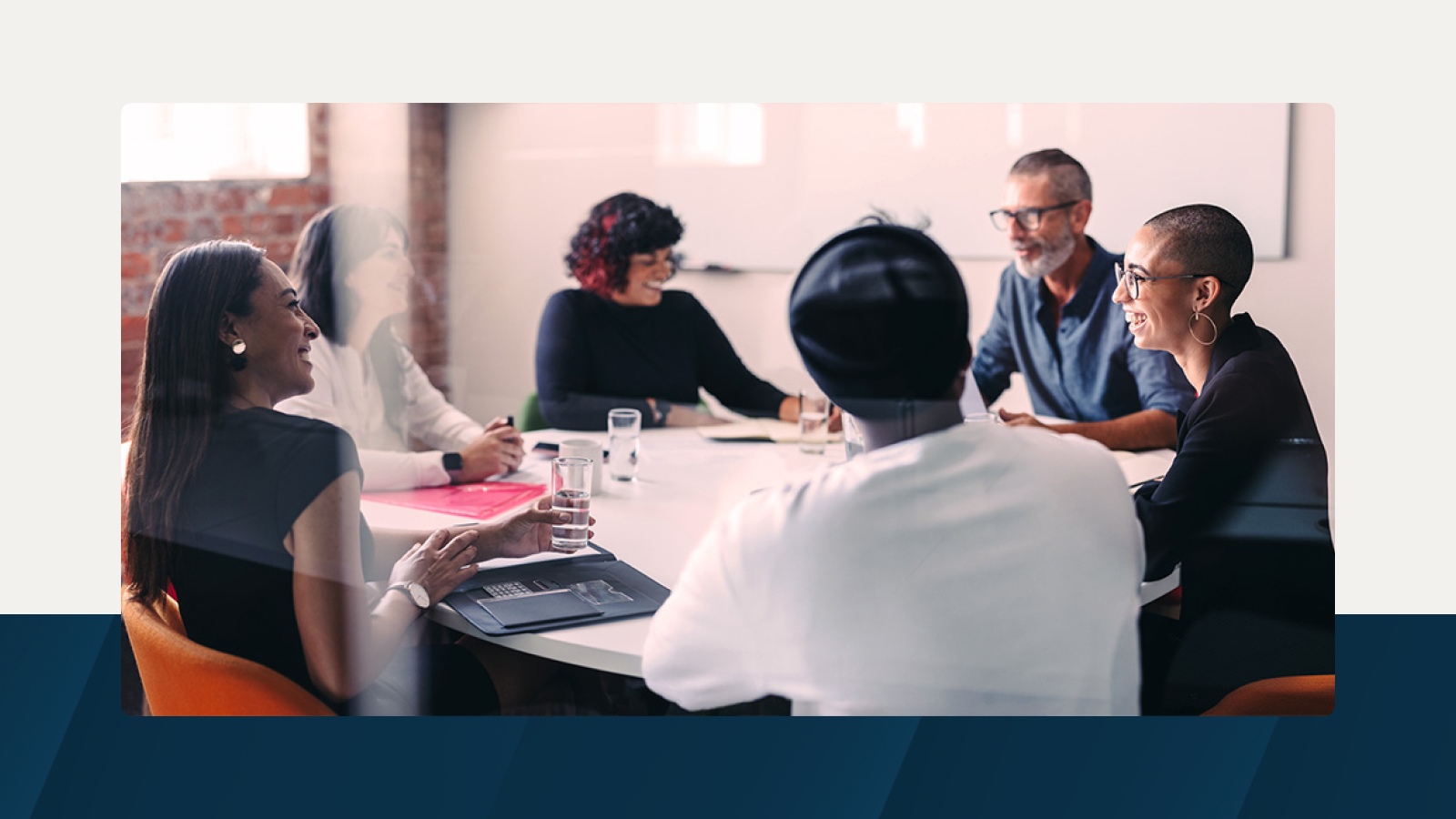 Anaplan solution brief on accelerating transformation and driving profitable growth in technology. The text highlights reducing uncertainties in decision-making, with an image of a diverse team in a meeting room.