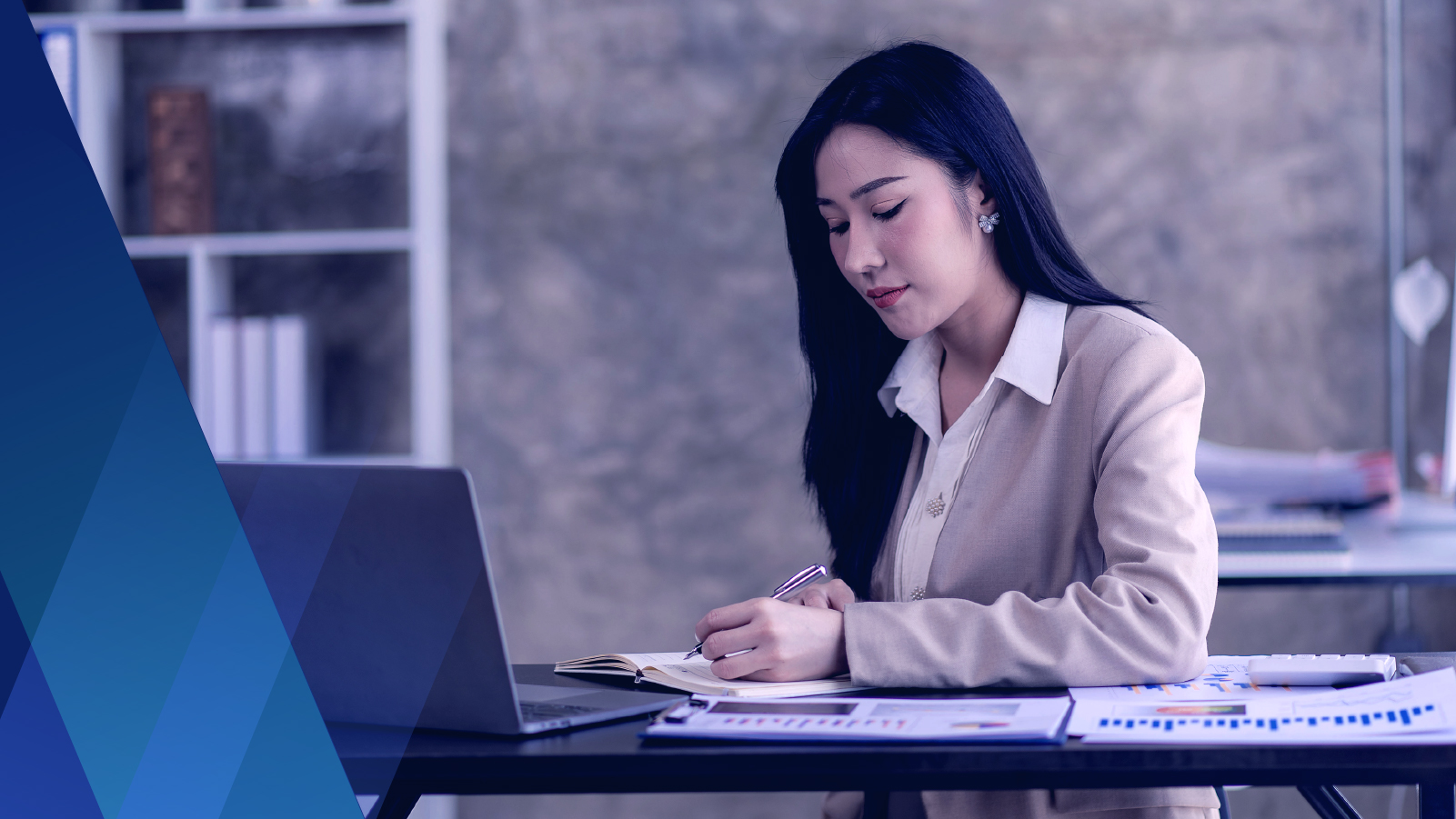 Woman in office working at her desk 